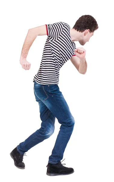 Rückansicht des Mann ausgeführt. zu Fuß Kerl in Bewegung. — Stockfoto