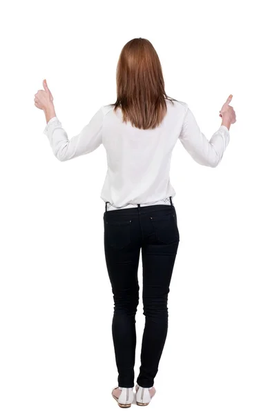 Back view of standing young redhead business woman showing thumb — Stock Photo, Image