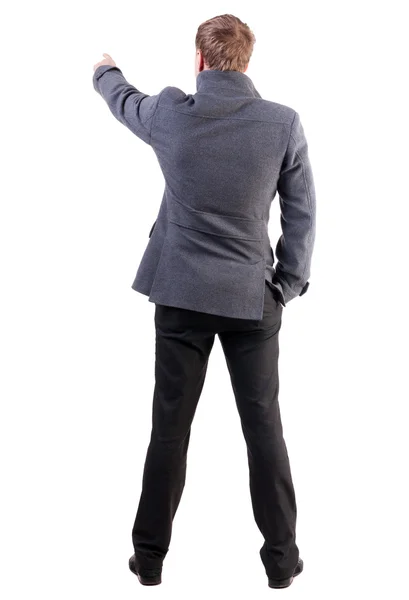 Back view of  pointing young business men in  coat — Stock Photo, Image