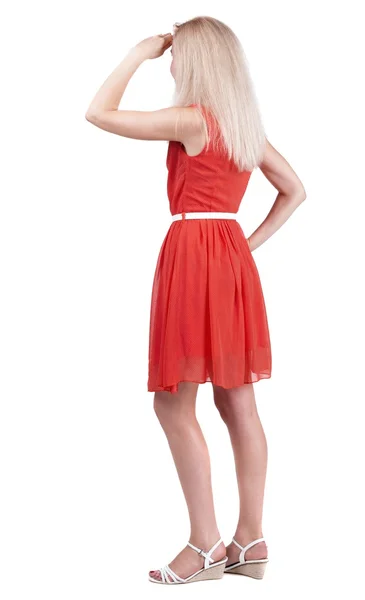 Back view of standing young beautiful  blonde woman. - Stock-foto