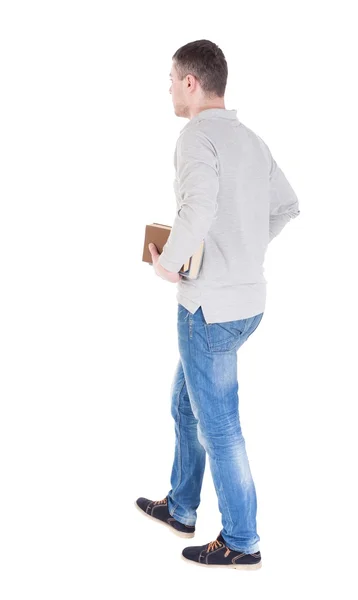 Man goes and has a stack of books. — Stock Photo, Image