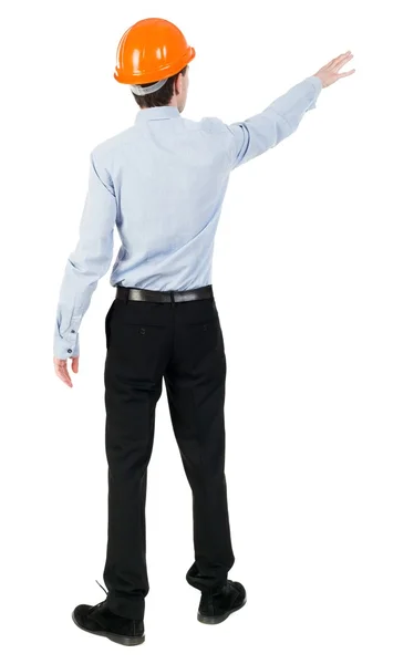 Back view of  pointing young men in  shirt and helmet. — Stock Photo, Image