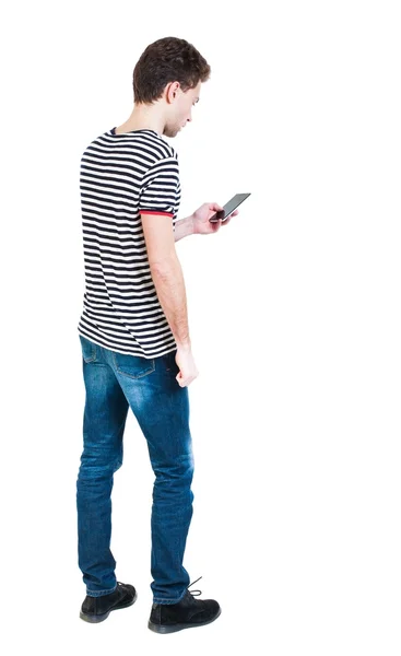 Back view of man in suit  talking on mobile phone. — Stockfoto