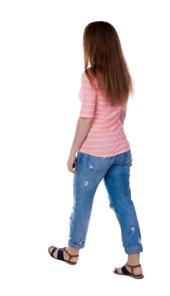 Walking woman in jeans Back view — Stock Photo, Image