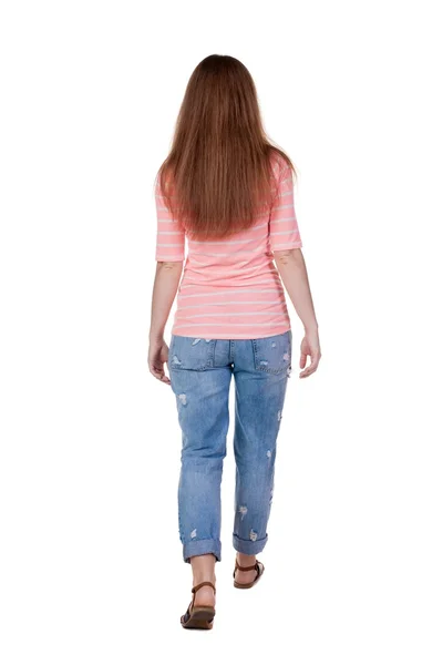 Walking woman in jeans Back view — Stock Photo, Image