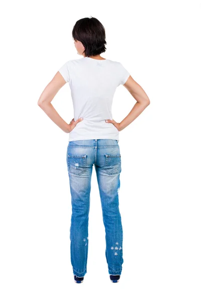 Standing woman in jeans Back view — Stock Photo, Image