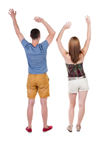 Par firar seger upp med händerna. — Stockfoto