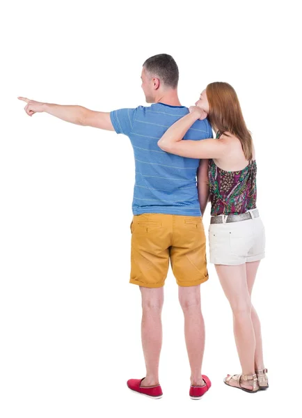 Pointing young couple Back view — Stock Photo, Image