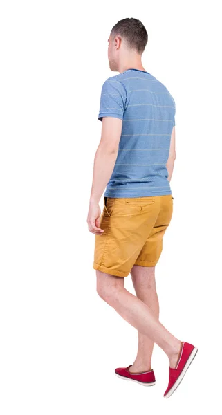 Back view of going  handsome man in shorts.  walking young guy — Stock Photo, Image