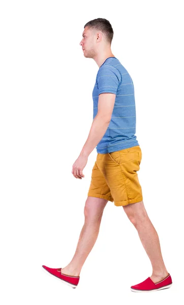 Back view of going  handsome man in shorts.  walking young guy — Stock Photo, Image