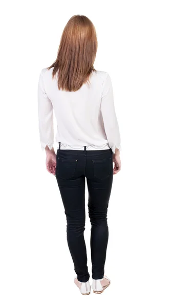 Standing woman in jeans Back view — Stock Photo, Image