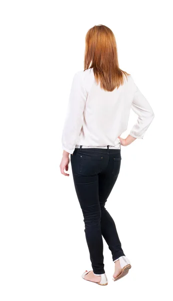 Walking woman in jeans Back view — Stock Photo, Image