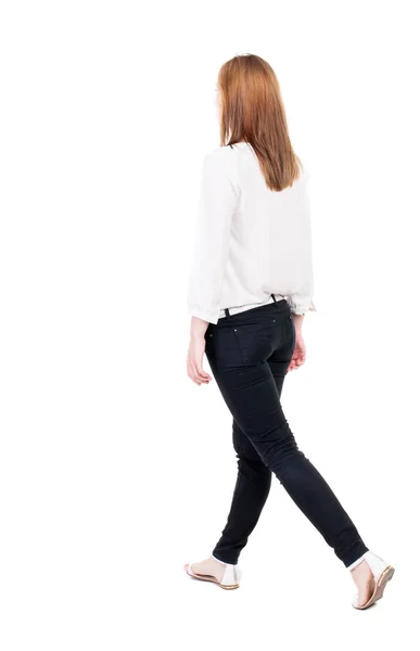 Walking woman in jeans Back view — Stok Foto