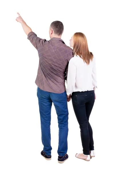 Ungt par pekar på wal bakifrån — Stockfoto