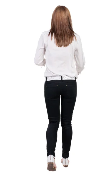 Walking woman in jeans Back view — Stock Photo, Image