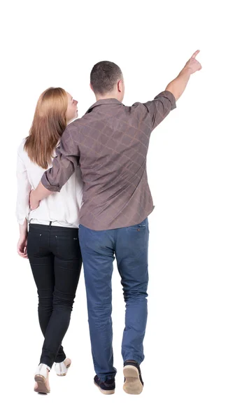 A fiatal pár (férfi és nő) mutató hátulnézet. — Stock Fotó