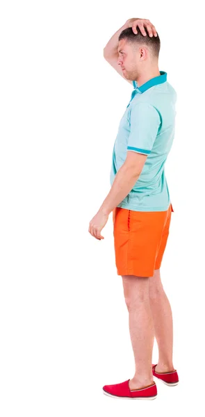 Back view of young manin shorts looking. — Stock Photo, Image