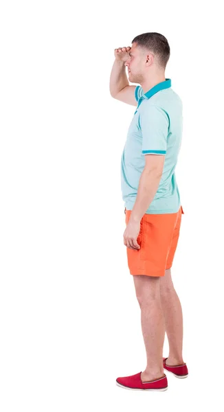 Back view of young manin shorts looking. — Stock Photo, Image