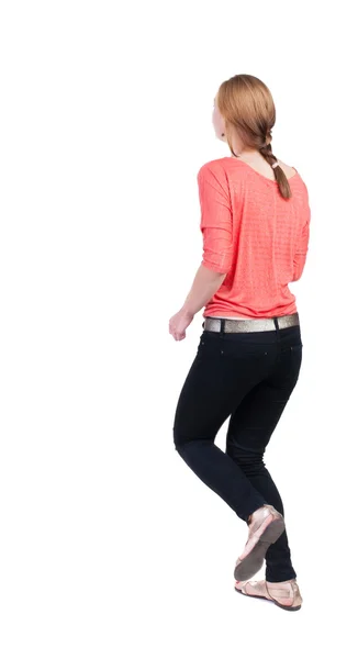 Running donna in jeans vista posteriore — Foto Stock