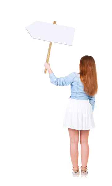 Rückansicht des Frau zeigt ein Schild. — Stockfoto