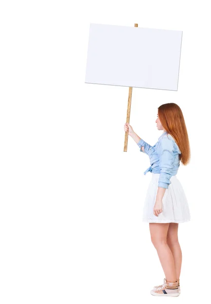 Back view  of woman showing a sign board. — Stock Photo, Image
