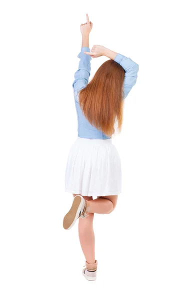 Vista posteriore della donna che punta . — Foto Stock