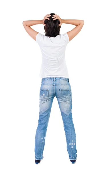 Вид ззаду шокованої жінки в блакитних джинсах . — стокове фото