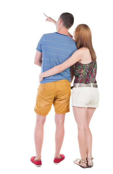 Pointing young couple Back view — Stock Photo, Image