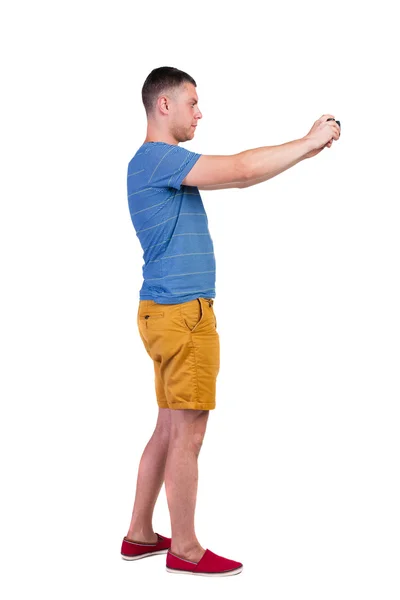 Back view of man photographing.  tourist in shorts. — Stock Photo, Image