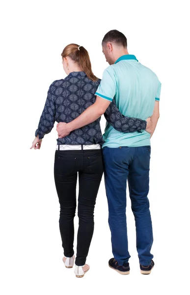 Pareja joven señala vista posterior — Foto de Stock