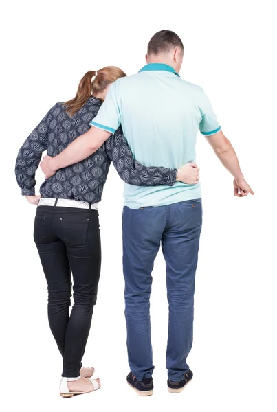 Pointing young couple Back view — Stock Photo, Image