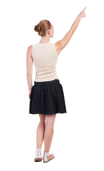 Apontando para cima mulher vista traseira — Fotografia de Stock