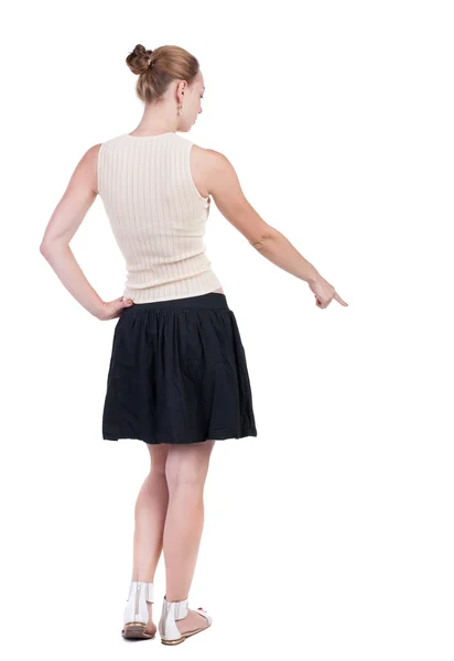 Pointing down woman back view — Stock Photo, Image