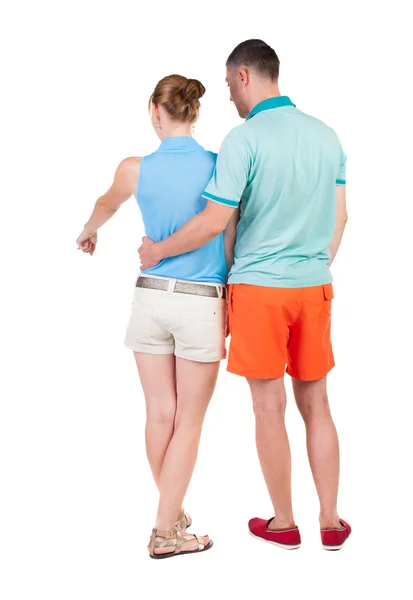 ポインティングの若いカップル背面図 — ストック写真