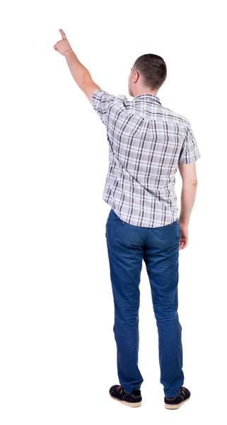 Pointing young man in  shirt and jeans. — Stock Photo, Image