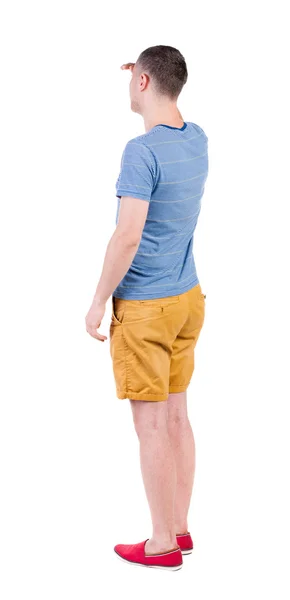 Back view of young manin shorts looking. — Stock Photo, Image