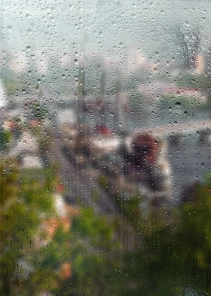 Outono vista da cidade através da janela — Fotografia de Stock