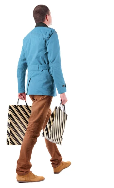 Vista traseira do homem com sacos de compras — Fotografia de Stock