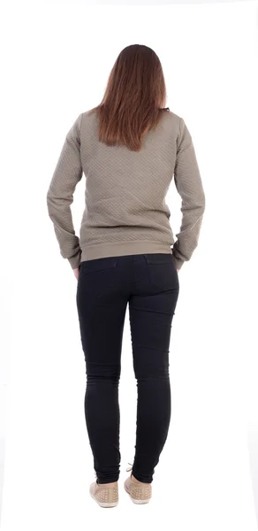 Stehende junge Frau in jeans — Stockfoto