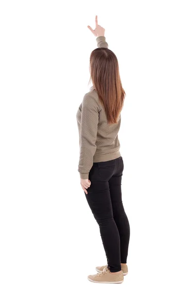 Vista posterior de la joven mujer señalando hacia arriba — Foto de Stock
