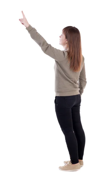 Vrouw in grijze trui wijzen weg — Stockfoto