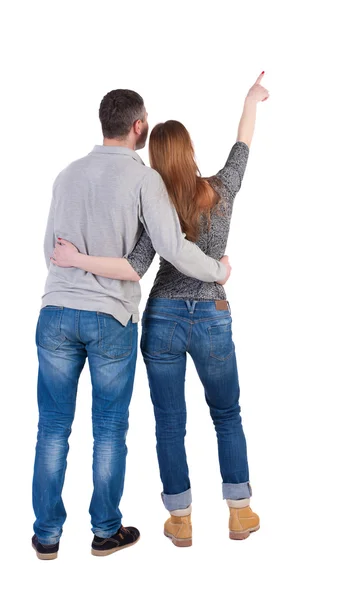 Young couple pointing away — Stock Photo, Image