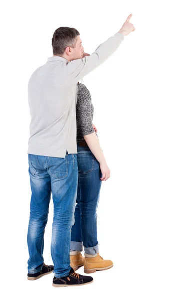 Young couple pointing away — Stock Photo, Image