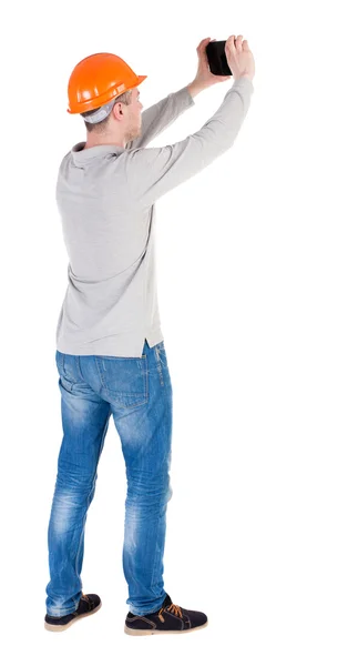 Engineer in helmet using digital tablet — Stock Photo, Image