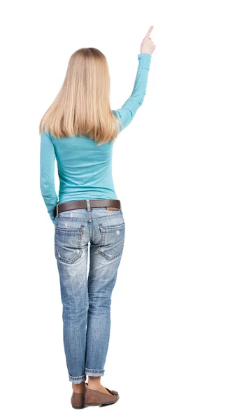 Bakifrån av blond kvinna pekar uppåt — Stockfoto