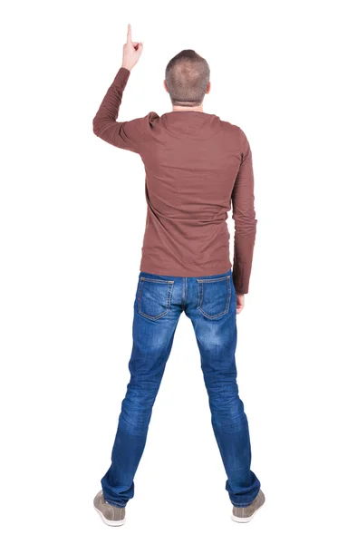 Man in shirt and jeans pointing up — Stock Photo, Image