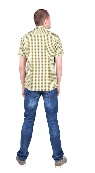 Man in checkered shirt looking up — Stock Photo, Image