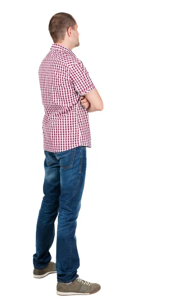 Man in checkered shirt looking up — Stock Photo, Image