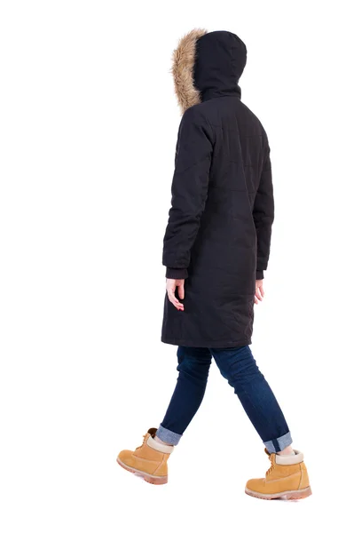 Woman walking in winter jacket - Stock-foto