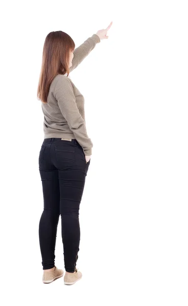 Back view of  young woman pointing away — Stock Photo, Image